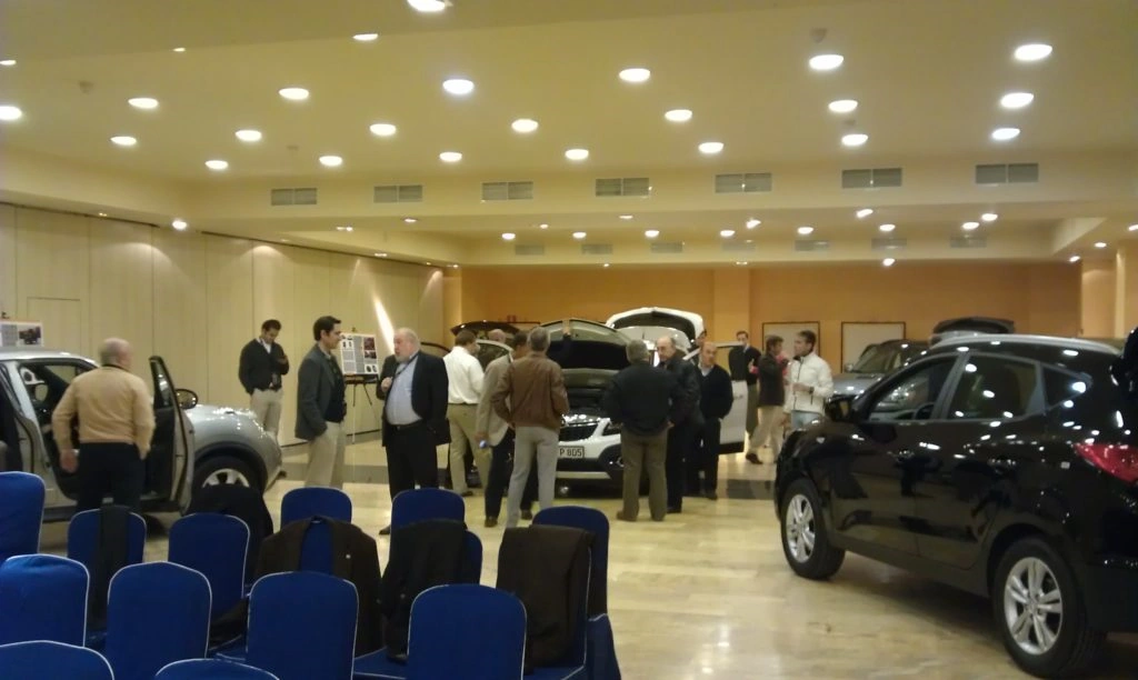 cars being examined by dealers at a launch