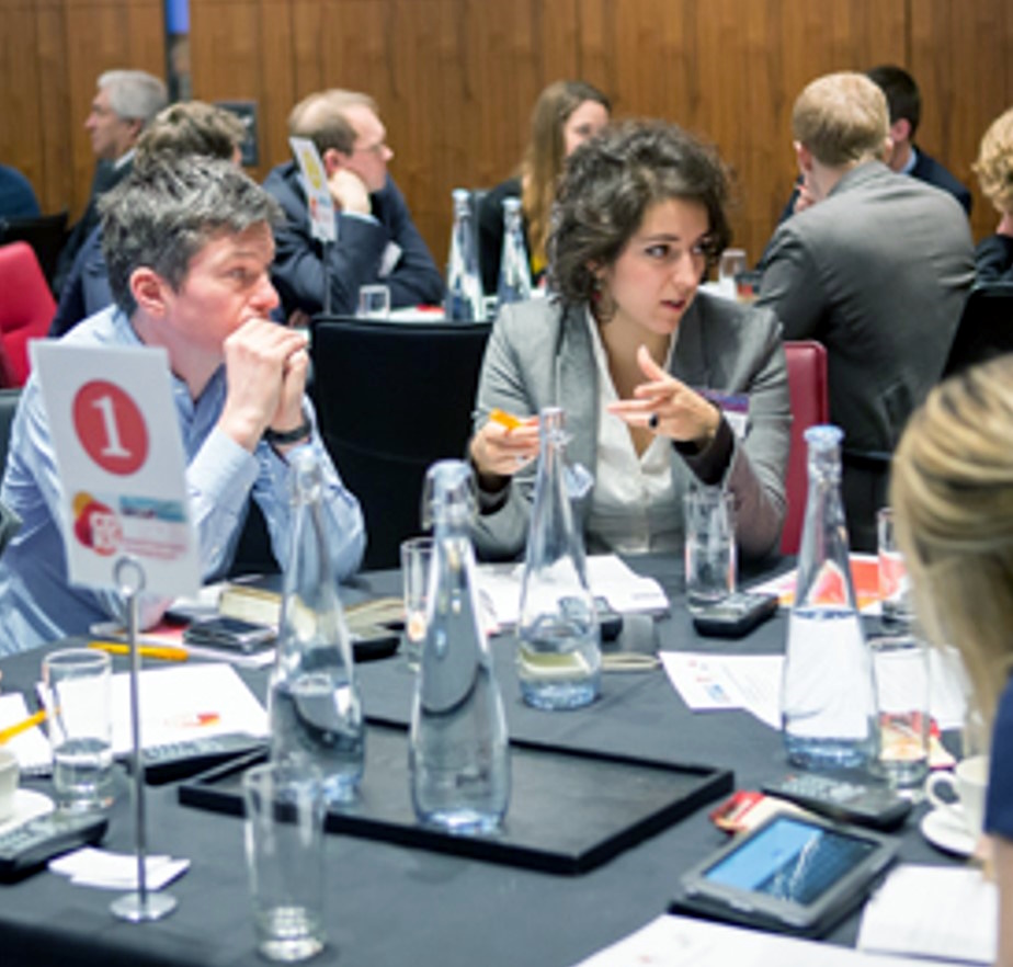 People around a table discussing something