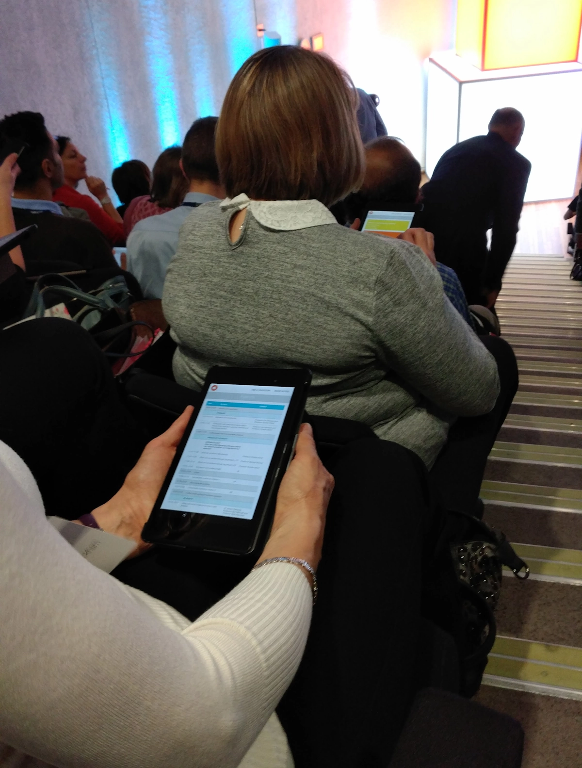 Delegate using smart device at a conference